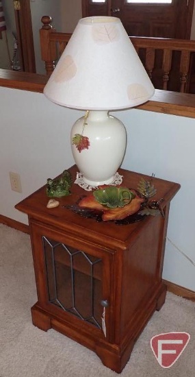 Side cabinet with lamp, heart shaped rock and decorator pieces