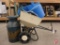Ortho broadcast spreader, plastic watering cans, painted milk can