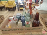 Washboard, sad irons, cowbells, bottles, buttons, oil lamp