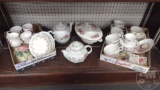 CUPS AND SAUCERS, TEA POTS AND WALL POCKET. ALL ON