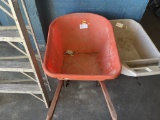 orange plastic wheelbarrow