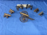 7 small brass cannons