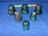 Six glass telegraph insulators