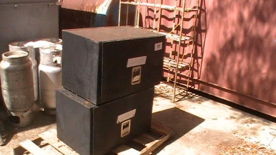 Two weather guard under bed metal black boxes