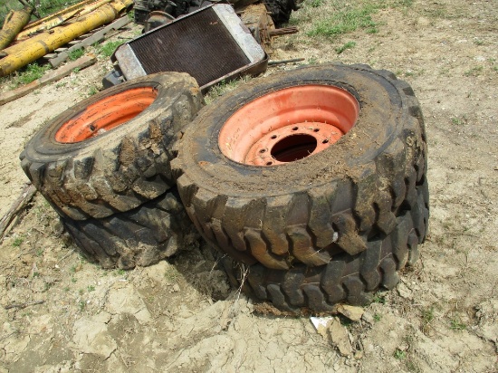 (4) 10 - 16.5 SKID STEER TIRES & WHEELS