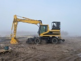 2001 M18 CATERPILLAR WHEELED EXCAVATOR,