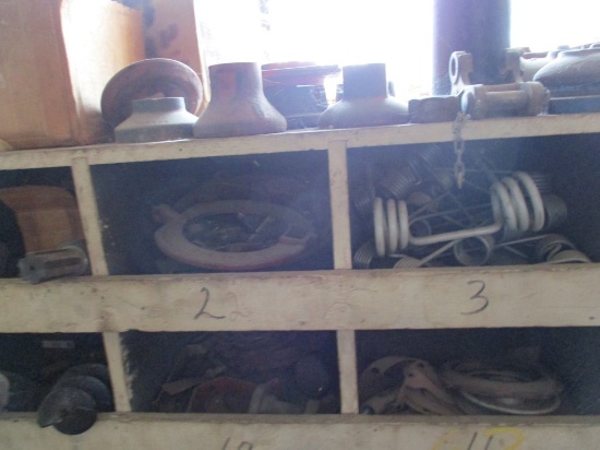 CONTENTS OF WOOD SHELF ON BACK WALL,  FILTERS, PARTS, SICKLE MOWER BLADES,
