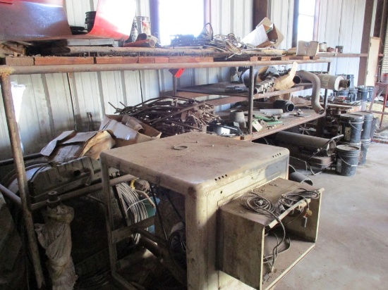 LOT OF IMPLEMENT PARTS, METAL STAND, BALER BELTS, BRACKETS, EXHAUST SYSTEM,