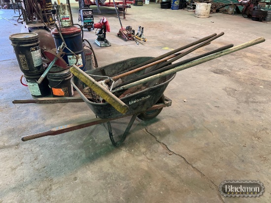 wheelbarrow, broom, shovels, rakes,