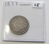 1877 SEATED QUARTER COUNTERSTAMPED