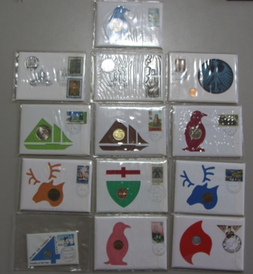13 STAMP AND COIN SETS VARIOUS COUNTRIES