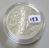 $1 SILVER COMMEMORATIVE UNINTED STATED MINT IN CAP