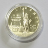 1986 ELLSI ISLAND $1 SILVER