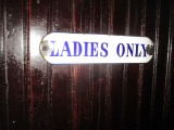 Antique enamel mens' and ladies' room signs