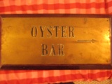 Oyster Bar Brass on wood plaque 22