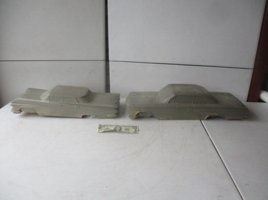 2 Resin Car body's, 1 Has Wheels, 1 - 20 1/2" and 1 17" long - 2 Pieces
