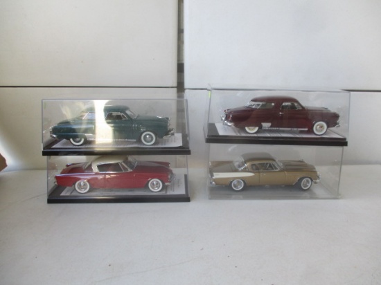 4 Danbury Mint 1:24 Scale Studebakers, 1950 Studebaker Coupe DM and 1951 Commander Coupe