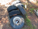 USED TIRES WITH RIMS & GROUND COVERING