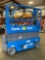 GENIE GS-1930 ELECTRIC SCISSOR LIFT, SELF PROPELLED, SLIDE OUT WORK PLATFORM, BUILT IN BATTERY