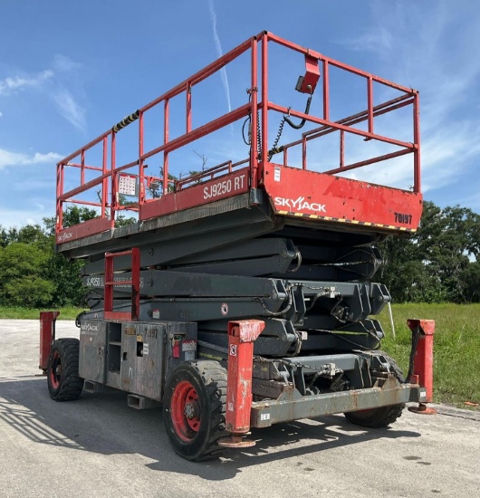 SKYJACK ROUGH TERRAIN SCISSORS LIFT MODEL SJ 9250, APPROX MAX PLATFORM HEIGHT 50FT, OUTRIGGERS