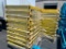 THREE STACKS OF YELLOW PUSH-BACK TRAYS/CARRIAGES FOR BLUE UPRIGHTS