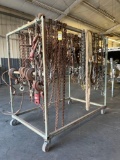 ENTIRE RACK OF RIGGING CHAINS, HOOKS, BINDERS, STRAPS, ETCS. RACK AND CONTENTS ALL SOLD TOGETHER.