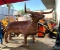 UNUSED LARGE METAL BULL CHARCOAL GRILL, APPROX 79IN LONG