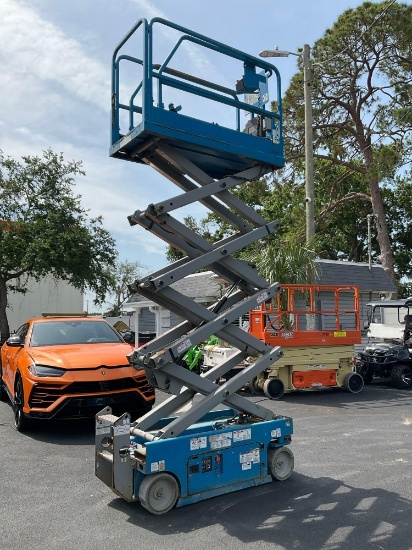 GENIE SCISSOR LIFT MODEL GS1930, ELECTRIC, APPROX MAX PLATFORM HEIGHT 19FT, BUILT IN BATTERY CHAR...