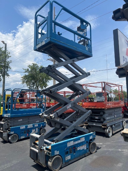 GENIE SCISSOR LIFT MODEL GS1930, ELECTRIC, APPROX MAX PLATFORM HEIGHT 19FT, BUILT IN BATTERY CHAR...