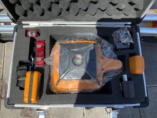 UNUSED SELF-LEVELING ROTARY LASER IN CARRYING CASE , OPERATING MANUAL MEASURING STICK & STAND INC...