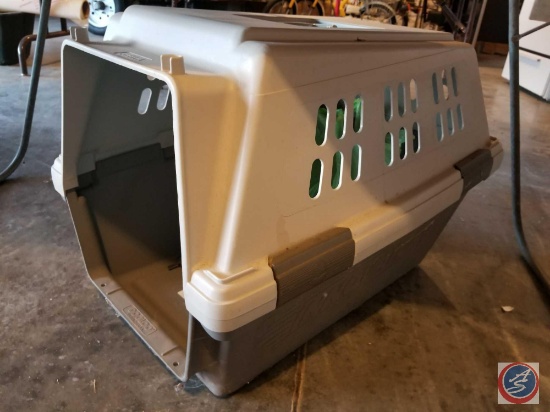 Medium size dog kennel measuring 27X20X19