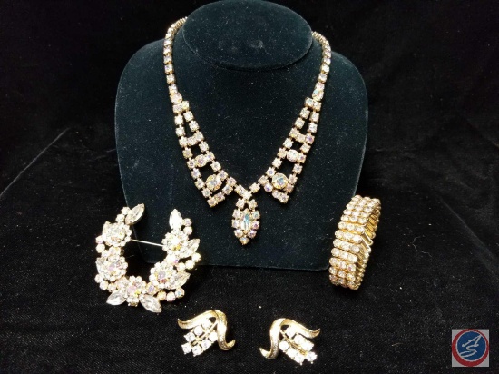 Multi colored rhinestone necklace with large brooch and clip on earrings, and a stretch rhinestone