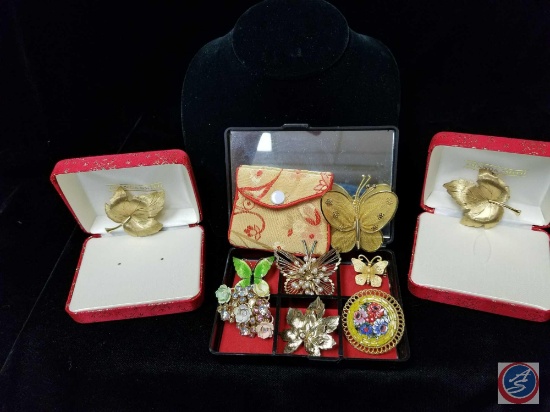 (9) assorted brooches, including butterflies, and leaves