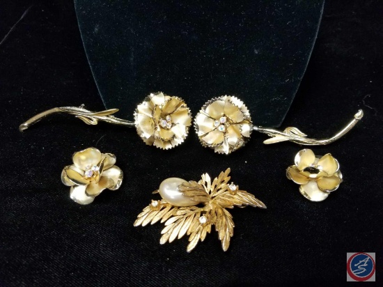 (2) matching intricate flower brooches with matching clip on earrings
