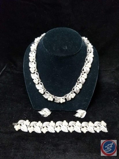 Set including necklace, clip on earrings, and matching bracelet