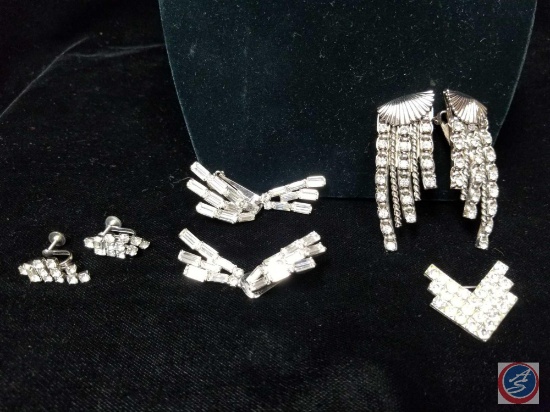 (3) sets of rhinestone earrings, and a small rhinestone brooch