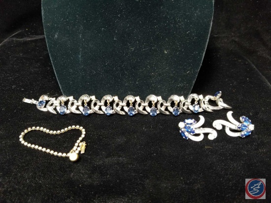 Blue rhinestone clasp bracelet with matching clip on earrings, and