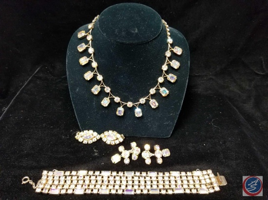 Multi colored rhinestone necklace with matching clasp bracelet and (2) sets of clip on earrings