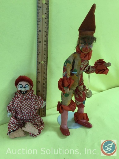 [2] ASSTD. DOLLS: a) 7" Creepy Clown doll w/ wood feet; b) 9.5" Mardi Gras Harlequin type doll. No