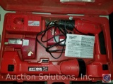 Milwaukee drill w/ (2) batteries and charger and cordless work light, Model #0415-02