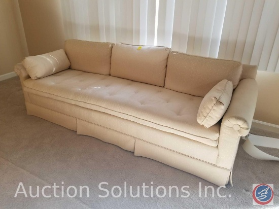 7ft. X 32" x 25.5" upholstered cream colored couch