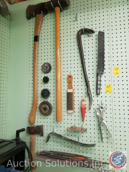 contents of pegboard to include ax, sledgehammer, files, grinding wheels, pry bars and more