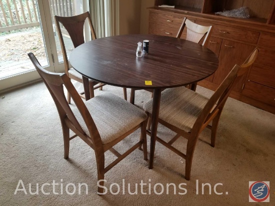 42" around and 28.5" tall round wooden dining table with 4 padded wooden chairs and 3 table