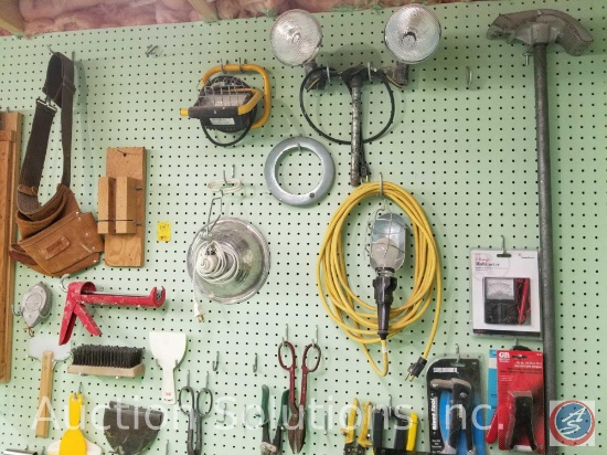 contents of pegboard to include multimeter rivet tool, cable stripper, work lights, leather tool