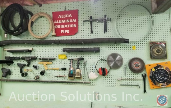 contents of pegboard to include vacuum hoses and accessories, saw blades and more (pegboard not
