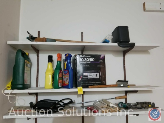 contents of shelves to include weed killer, starter charger, hose nozzles, squeegee and more
