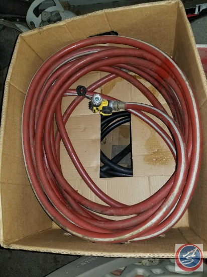 (2) boxes containing black and red hoses