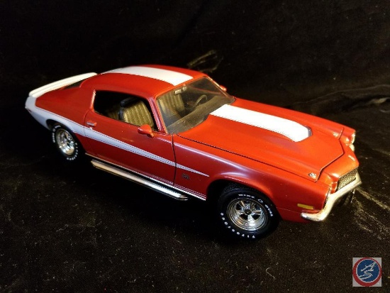 1970s die cast Camaro, red in color with white racing stripes