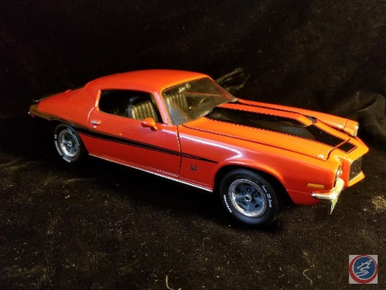 1970s die cast Camaro, red in color with black racing stripes