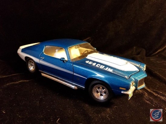 Die cast Camaro, blue in color with white racing stripes